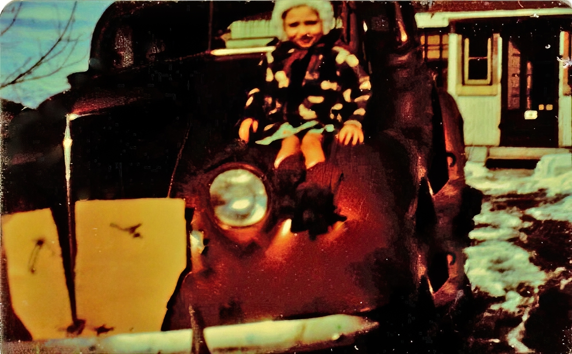 Small child on car from about 1948 or 1949